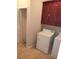 Laundry room with washer, dryer, and wooden cabinets at 7025 Fletcher Dr, Winston, GA 30187