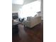Living room with hardwood floors, stone fireplace, and access to backyard at 7025 Fletcher Dr, Winston, GA 30187