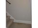 Carpeted staircase with wooden handrail at 7025 Fletcher Dr, Winston, GA 30187
