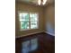 Bedroom with dark hardwood floors and a large window at 7025 Fletcher Dr, Winston, GA 30187