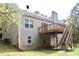Two-story home with deck, stairs, and a view of the backyard at 7025 Fletcher Dr, Winston, GA 30187