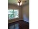 Well-lit bedroom with hardwood floors and large window at 7025 Fletcher Dr, Winston, GA 30187