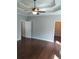 Main bedroom with hardwood floors, ceiling fan and walk-in closet at 7025 Fletcher Dr, Winston, GA 30187