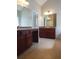 Spacious bathroom with double vanities, large mirrors, and a garden tub at 7025 Fletcher Dr, Winston, GA 30187