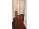 Hardwood floors in a bright hallway with access to other rooms at 7025 Fletcher Dr, Winston, GA 30187