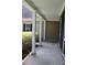 Front porch with stone flooring, white columns and view of landscaping at 7025 Fletcher Dr, Winston, GA 30187