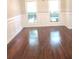 Formal dining room features hardwood floors and wainscoting at 7025 Fletcher Dr, Winston, GA 30187