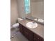 Clean bathroom with a vanity, toilet and bathtub at 7025 Fletcher Dr, Winston, GA 30187