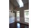 Bright dining room with hardwood floors, wainscoting, and large windows at 7025 Fletcher Dr, Winston, GA 30187