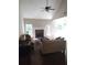 Spacious living room features hardwood floors, fireplace, and access to deck at 7025 Fletcher Dr, Winston, GA 30187