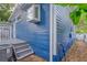 Side view of blue house with gray steps leading to a deck at 580 Hansell Se St, Atlanta, GA 30312