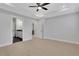 Spacious bedroom with light grey walls and wood-look flooring at 374 Boundless Ln, Canton, GA 30114