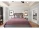 Main bedroom with king-size bed, hardwood floors, and ensuite bathroom access at 3378 Chosen Blvd, Snellville, GA 30078