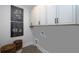 Convenient laundry room with cabinets and a utility sink at 3378 Chosen Blvd, Snellville, GA 30078