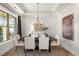 Elegant dining room with chandelier and large windows at 3378 Chosen Blvd, Snellville, GA 30078
