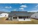 Back of house with screened porch and large backyard at 3378 Chosen Blvd, Snellville, GA 30078