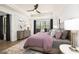 Main bedroom with king bed, hardwood floors, and a view to backyard at 3378 Chosen Blvd, Snellville, GA 30078