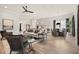 Open living room with hardwood floors, neutral color palette, and access to kitchen and dining area at 3378 Chosen Blvd, Snellville, GA 30078