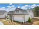 Exterior view of charming house with brick and siding at 3378 Chosen Blvd, Snellville, GA 30078
