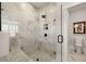 Spa-like bathroom with a large walk-in shower and marble tile at 3378 Chosen Blvd, Snellville, GA 30078