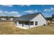 Rear view of home showcasing screened porch and patio at 3378 Chosen Blvd, Snellville, GA 30078