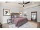 Main bedroom with king bed, hardwood floors, and a large mirror at 3378 Chosen Blvd, Snellville, GA 30078