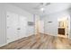 Secondary bedroom with wood-look floors and double doors at 6645 Cortland Walk, Alpharetta, GA 30005