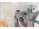 Bright laundry room, features a washer and dryer at 1090 Crown River Pkwy, Mcdonough, GA 30252