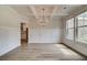 Bright dining room features a chandelier, hardwood floors, and decorative wall paneling at 25 Homesite Cooper E Cv, Fayetteville, GA 30215