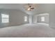 Spacious main bedroom with carpeted floors and multiple windows at 25 Homesite Cooper E Cv, Fayetteville, GA 30215