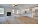 Open Gathering room includes a fireplace and kitchen island at 25 Homesite Cooper E Cv, Fayetteville, GA 30215