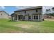 Newly built home with a spacious backyard and patio at 25 Homesite Cooper E Cv, Fayetteville, GA 30215