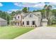 Two story home with attached garage and landscaping at 25 Homesite Cooper E Cv, Fayetteville, GA 30215