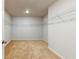 Large walk-in closet with wire shelving and carpeted floors at 25 Homesite Cooper E Cv, Fayetteville, GA 30215