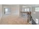 Spacious loft area with open railing and carpet at 25 Homesite Cooper E Cv, Fayetteville, GA 30215