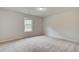 Simple bedroom with window and carpet at 25 Homesite Cooper E Cv, Fayetteville, GA 30215