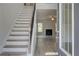 Bright entryway with staircase and view of living room at 25 Homesite Cooper E Cv, Fayetteville, GA 30215