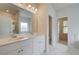 Double vanity bathroom with marble flooring and a shower at 25 Homesite Cooper E Cv, Fayetteville, GA 30215