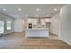 Modern kitchen with white cabinets and large kitchen island at 25 Homesite Cooper E Cv, Fayetteville, GA 30215