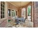 Brick patio with a metal table and chairs, perfect for outdoor dining at 2867 Darlington Run, Duluth, GA 30097
