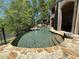 Luxury pool with a waterfall and flagstone patio at 2867 Darlington Run, Duluth, GA 30097
