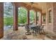 Brick patio with arched columns overlooking the pool and lake at 2867 Darlington Run, Duluth, GA 30097
