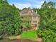 Luxury home on waterfront lot with pool and lush landscaping at 2867 Darlington Run, Duluth, GA 30097