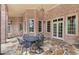 Brick patio with a metal table and chairs, perfect for outdoor dining at 2867 Darlington Run, Duluth, GA 30097