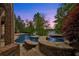 Stone pool and hot tub overlooking lake at sunset at 2867 Darlington Run, Duluth, GA 30097
