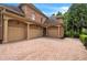 Three-car garage with brick and stone exterior and paver driveway at 2867 Darlington Run, Duluth, GA 30097
