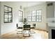 Charming breakfast nook with a round table and green velvet chairs at 1277 Avalon Ne Pl, Atlanta, GA 30306