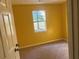 Simple bedroom with neutral carpeting and a window at 1576 King Mill Rd, Mcdonough, GA 30252