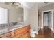 Bathroom with granite countertop, wood cabinets and shower at 309 Marbella Way, Mcdonough, GA 30252