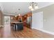 Island kitchen with stainless steel appliances and dark wood cabinets at 309 Marbella Way, Mcdonough, GA 30252